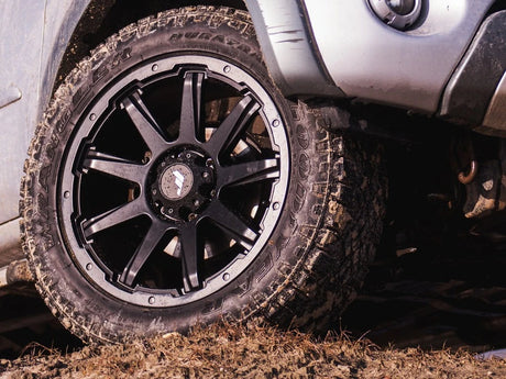 Close-up of a rugged tire with detailed tread, ideal for pickup truck enhancements, reflecting Brute Status's focus on aftermarket auto accessories.