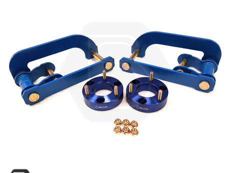 Close-up of blue metal auto parts with screws and gold nuts, suitable for aftermarket pick-up truck customizations.