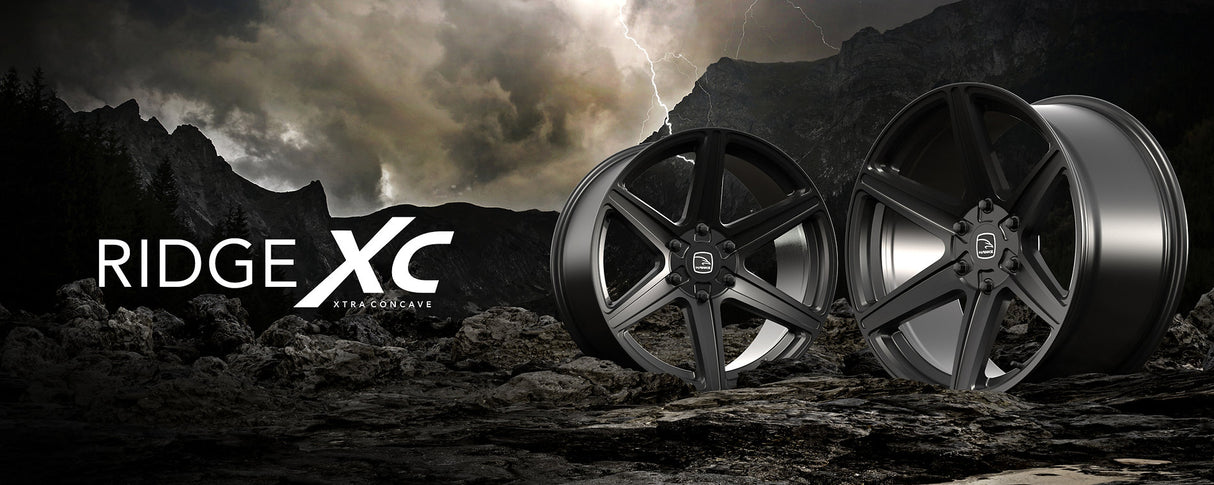 Hawke Wheels Ridge displayed on rocky terrain, emphasizing its rugged design and suitability for customization in trucks, available in 20-inch size.