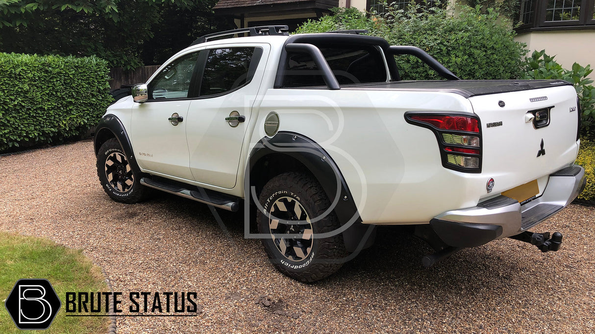 Mitsubishi L200 Series 5 2015-2019 Fender Flares on a white truck, showcasing wide arches and faux bolts, ideal for double cab models.