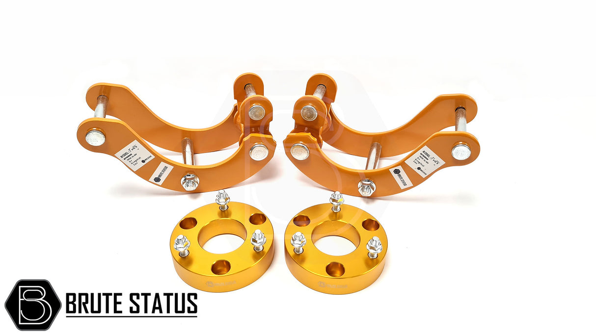 Mitsubishi L200 Series 4 B40 2005-2015 2.5 Lift Kit with orange metal shock spacers and gold bolts, enhancing truck height and durability.