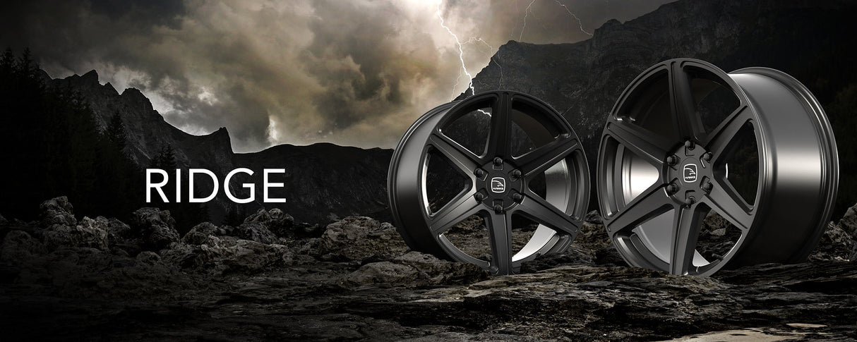 Hawke Wheels Ridge displayed on rocky terrain, highlighting the sleek design and durability of the 20-inch aftermarket rims, ideal for enhancing pick-up trucks.