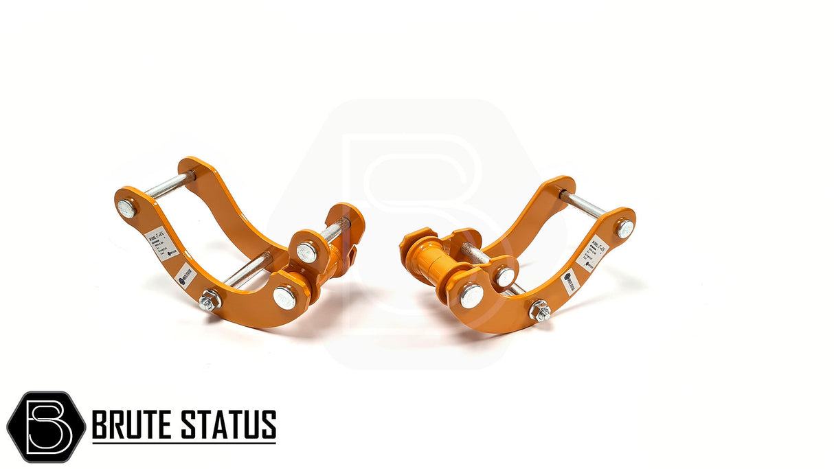 Mitsubishi L200 Series 4 B40 2005-2015 2.5 Lift Kit featuring orange metal shock spacers and heavy-duty rear lift shackles for enhanced truck height.