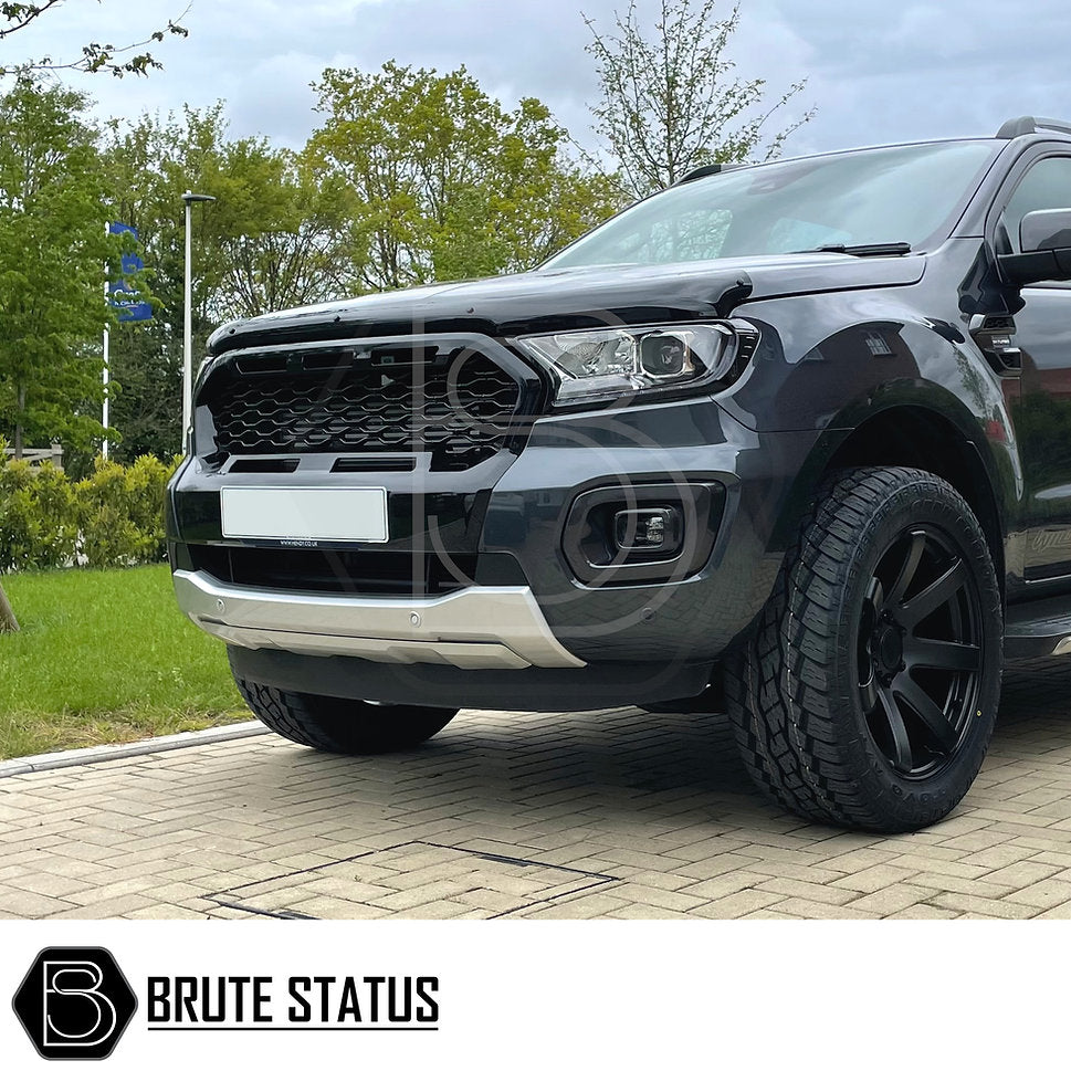 Ford Ranger 2019-2022 T8 Gloss Black & Silver Grille for Wildtrak, featuring a sleek design on a parked truck, highlighting its high-quality ABS construction.