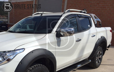 Mitsubishi L200 Series 6 2019-2021 window deflectors, premium black acrylic, visible on a parked truck, offering rain protection and aerodynamic design.