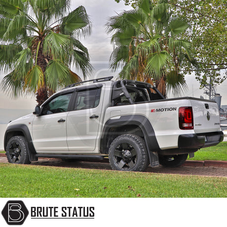 Volkswagen Amarok 2010-2022 Roll Bar Matte Black on a white truck, showcasing its robust steel construction and sleek design, enhancing vehicle's aggressive appearance.