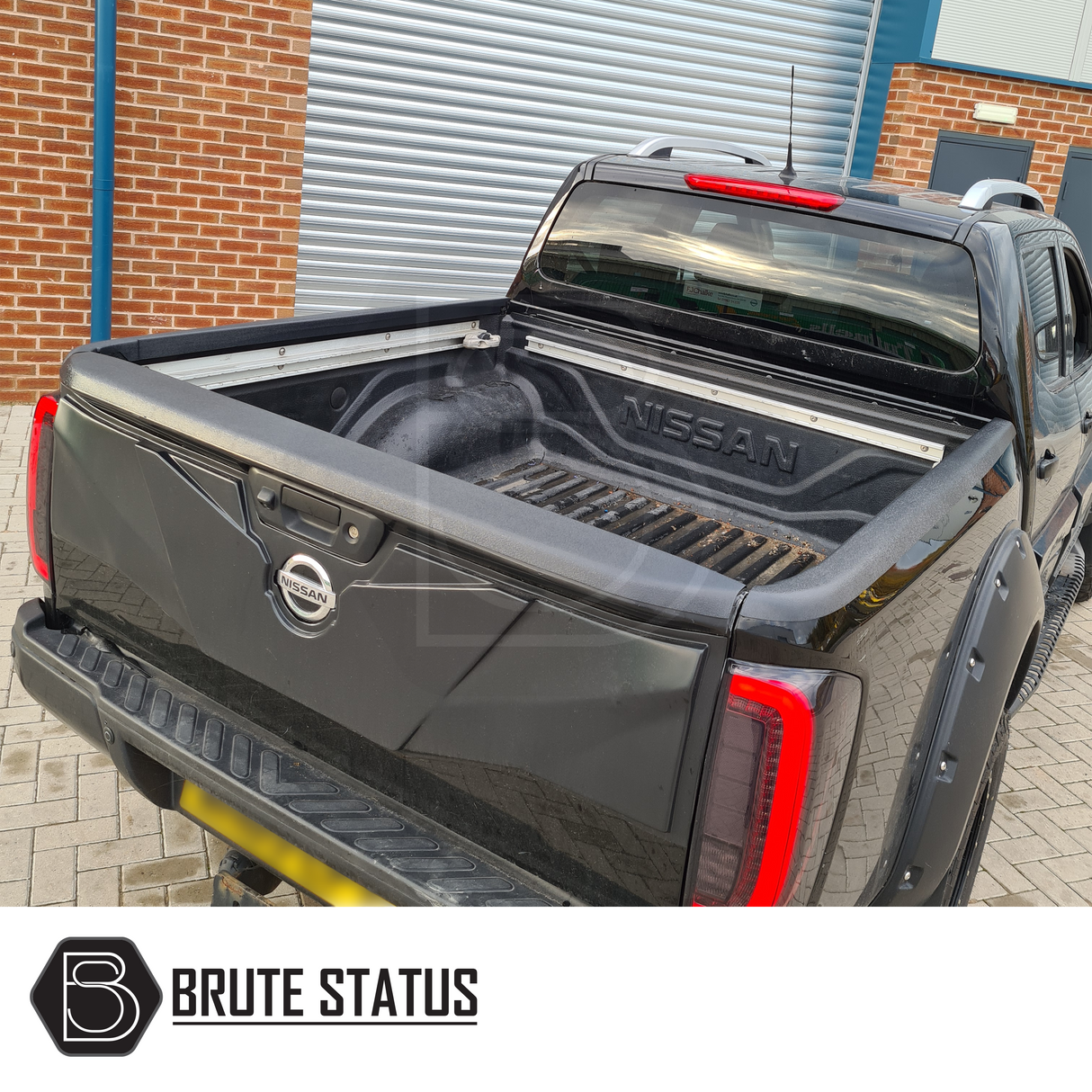 Nissan Navara NP300 2015-2022 Load Bed Rail Protector Set displayed on a black truck, showcasing its tailored fit for enhanced utility.