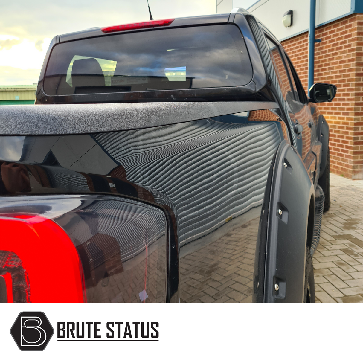 Nissan Navara NP300 2015-2022 Load Bed Rail Protector Set on black truck, showcasing high-quality ABS plastic design for enhanced truck customization.