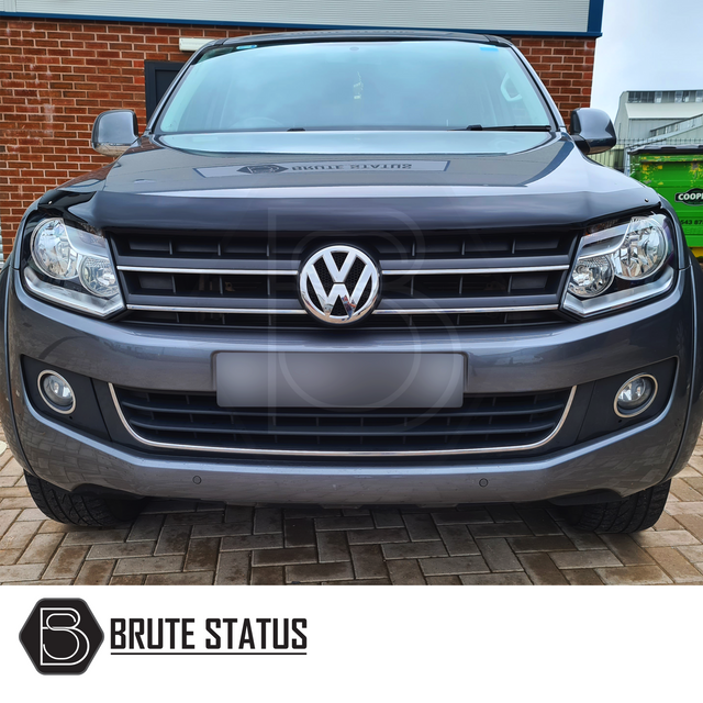 VW Amarok 2010-2022 Bonnet Guard Stone Deflector/Protector, shown on a parked car, emphasizes protection and style for pickup trucks.