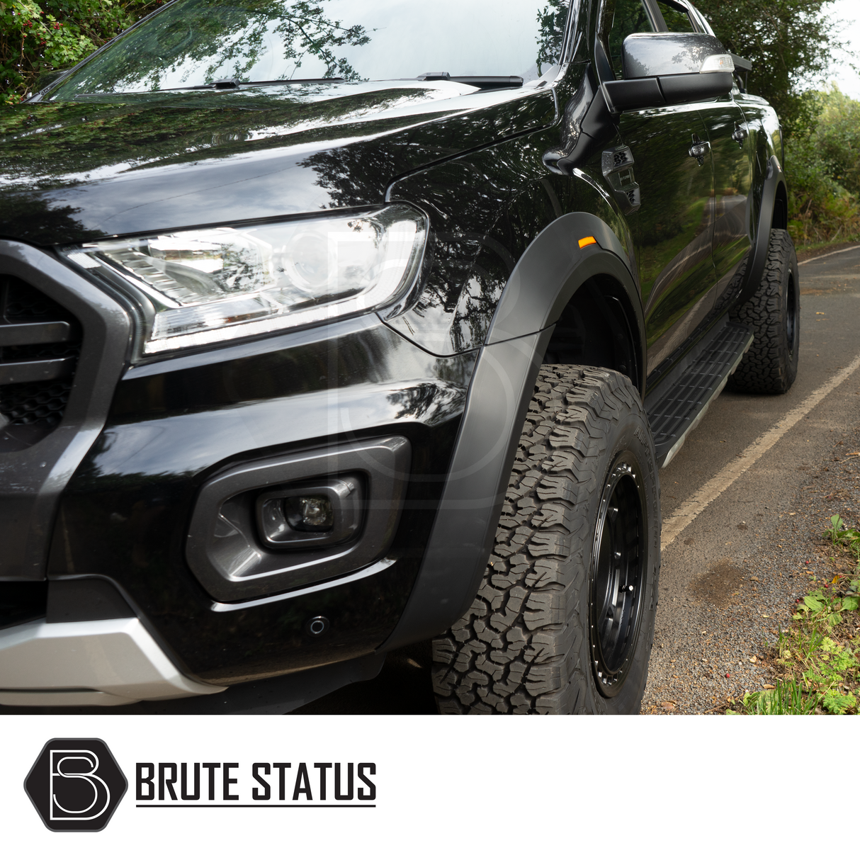 Ford Ranger 2015-2022 T7 T8 Wide Arch Kit (OEM Style) & 35mm Wheel Spacers shown on a parked black truck, highlighting its robust, customized appearance.