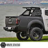 Mitsubishi L200 Series 5 2015-2019 M10 Roll Bar showcased on a parked truck by water, emphasizing its robust design and aggressive styling.