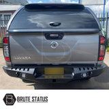 Nissan Navara D40 2010-2015 rear bumper in matt black, featuring knock-out sensor holes and lights, designed to enhance style and protection.