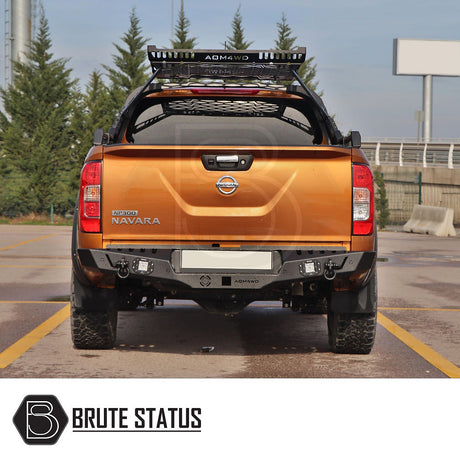 Nissan Navara D40 2010-2015 rear bumper in matt black, showcasing a stylish design with integrated lights and sensor holes.