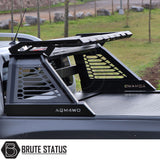 Toyota Hilux 2010-2014 M10 Roll Bar on a black truck bed, showcasing its heavy-duty steel construction and matte black finish.