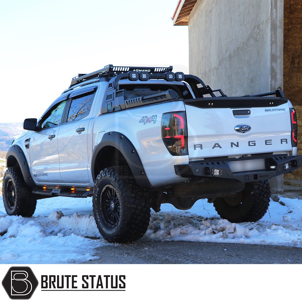 Ford Ranger 2012-2022 Combat Roll Bar with LED Lights, showcasing a rugged design in snow, highlighting its heavy-duty steel construction and matte black finish.