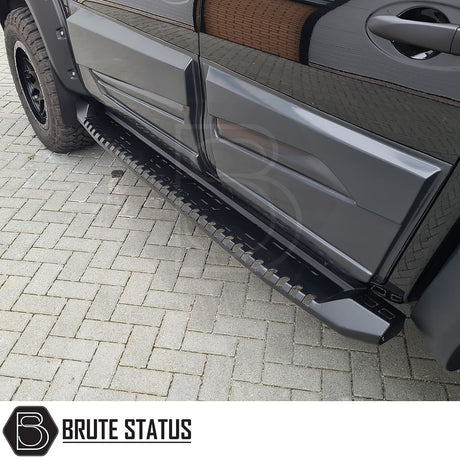 Close-up of Mitsubishi L200 Series 4 2007-2014 heavy duty S30 steel side steps, showcasing the durable matt black finish and robust design.