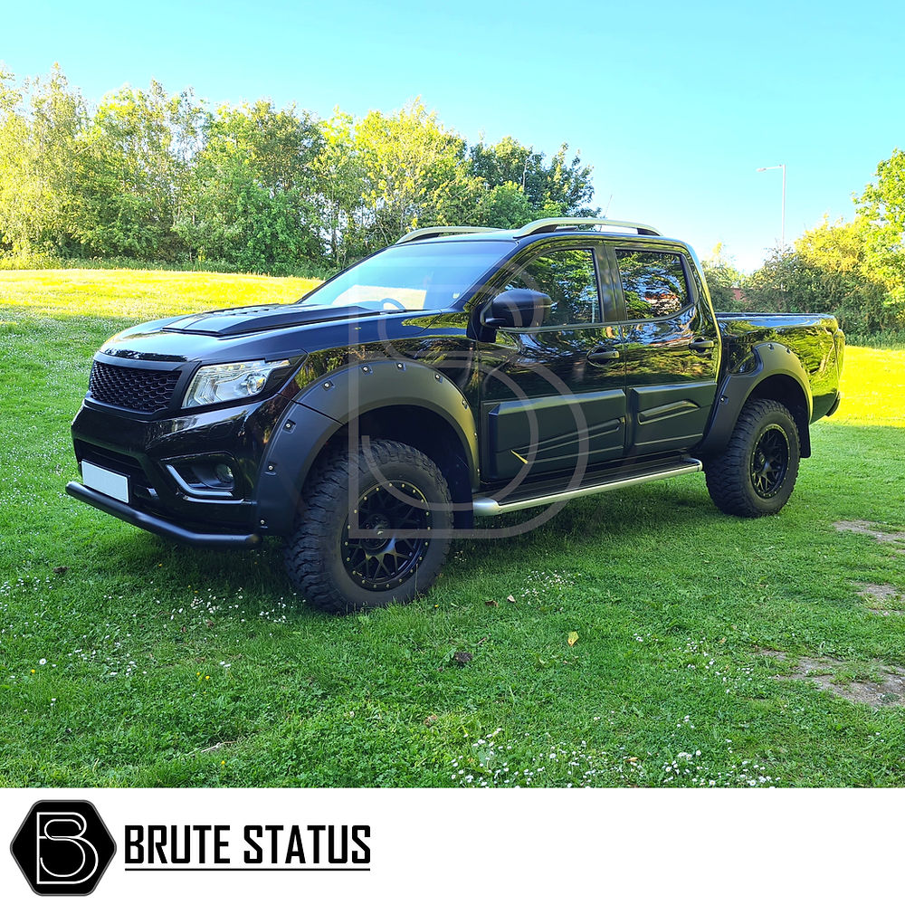 Mitsubishi L200 Series 4 2006-2014 City Bar shown enhancing a parked black truck's bumper, emphasizing protection and style with its matt black finish.