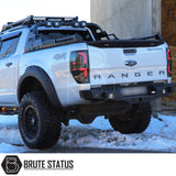 Ford Ranger 2012-2022 Combat Roll Bar with LED Lights, shown in snow, features heavy-duty steel, matt black finish, enhancing truck's aggressive look.