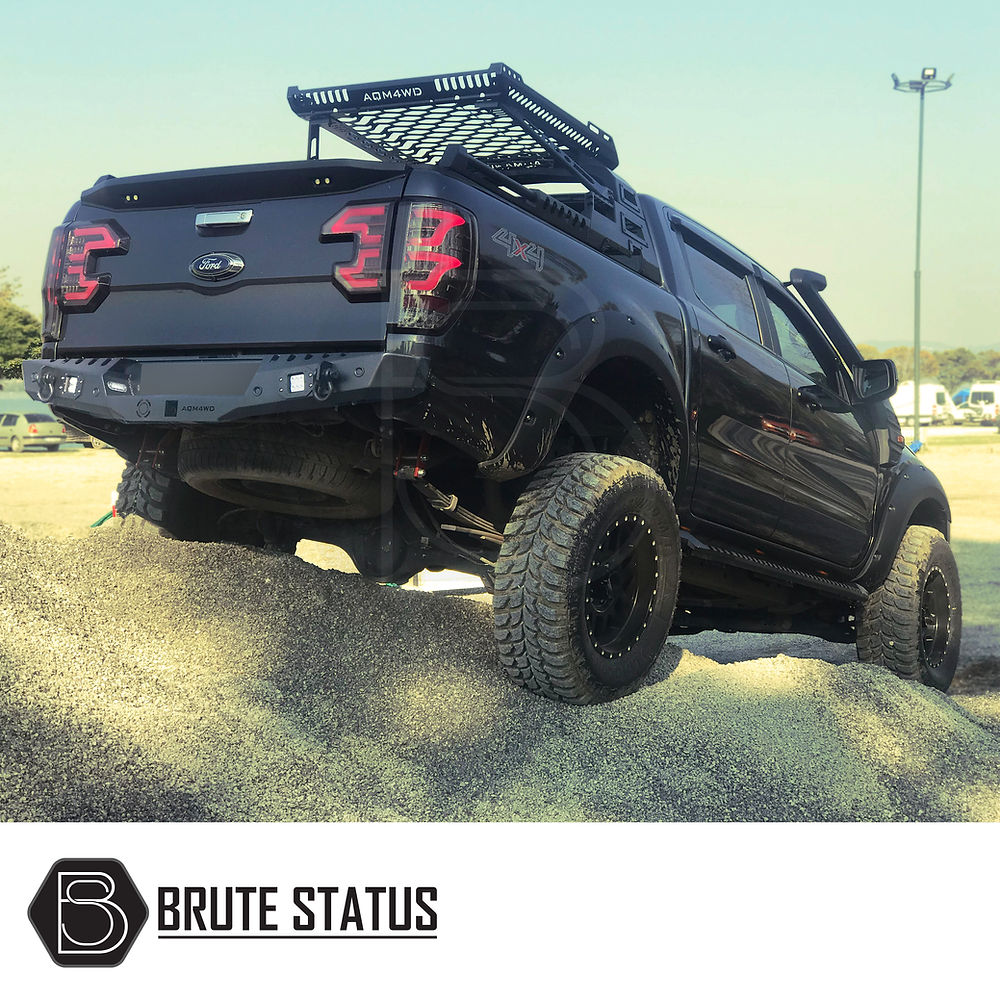 Isuzu D-Max 2021+ Rear Bumper, matt black, shown fitted on a black truck, highlighting its sleek design and durability for off-road use.