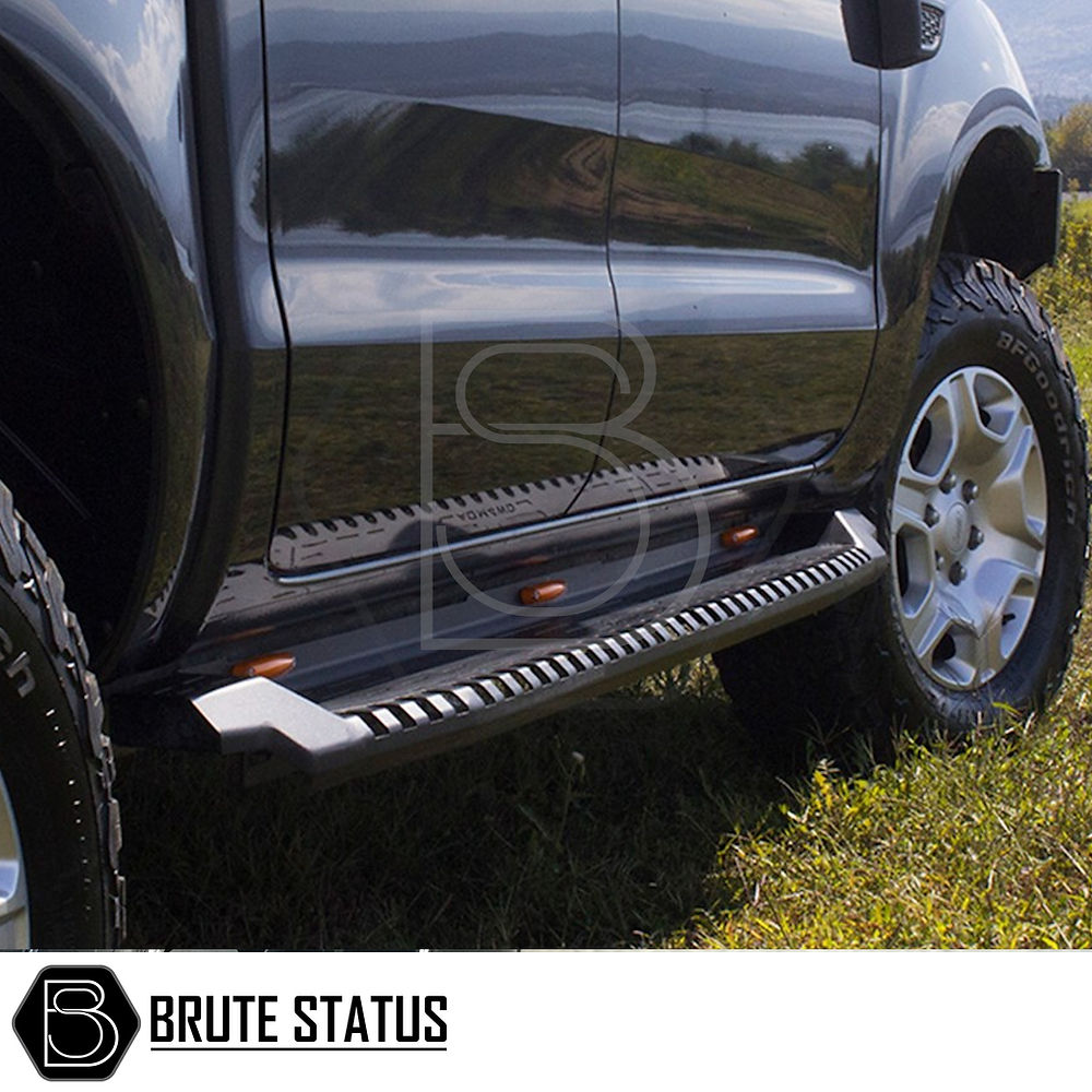 Toyota Hilux 2015+ Heavy Duty S30 Steel Side Steps in matt black, designed for durability and protection, shown in close-up with vehicle exterior details.