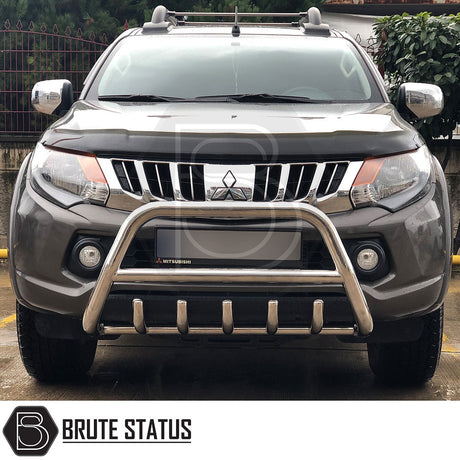 Mitsubishi L200 Series 5 2015-2019 A-Bar (Nudge Bar) Polished, enhancing bumper protection and style, visible on parked vehicle.