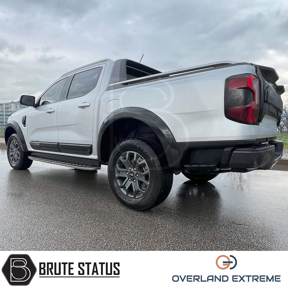 Ford Ranger 2023+ T9 Gloss Black Wide Arch Kit, showcasing premium quality wheel arches for enhanced vehicle aesthetics and fitment, visible on a parked truck.