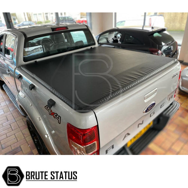 Tonneau Cover for Ford Ranger 2012-2022 Double Cab in showroom, highlighting its tri-fold design and premium features for enhanced aerodynamics and durability.