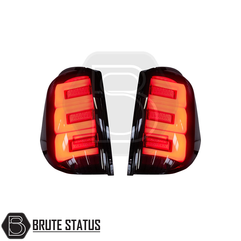 Mitsubishi L200 MK4 2006-14 LED Tail Lights: Close-up of aftermarket LED tail light unit, showcasing clear lenses and sequential indicators for enhanced vehicle style.