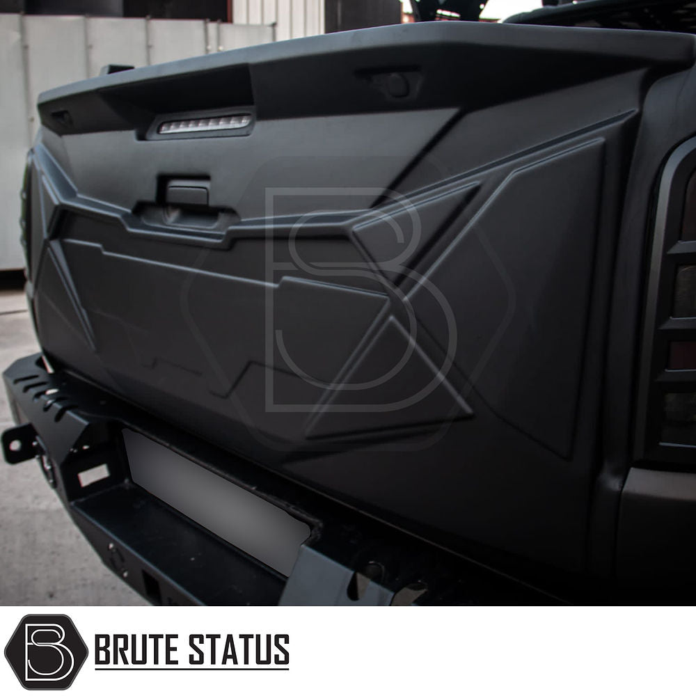 Mitsubishi L200 2019-2021 Series 6 Tailgate Cladding Cover, durable ABS plastic, matte black finish, designed for easy installation and protection.