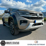 Volkswagen Amarok 2023+ Matte Black Wide Arch Kit, featuring premium ABS plastic and precise fitment, parked in a lot showcasing Overland Extreme quality.