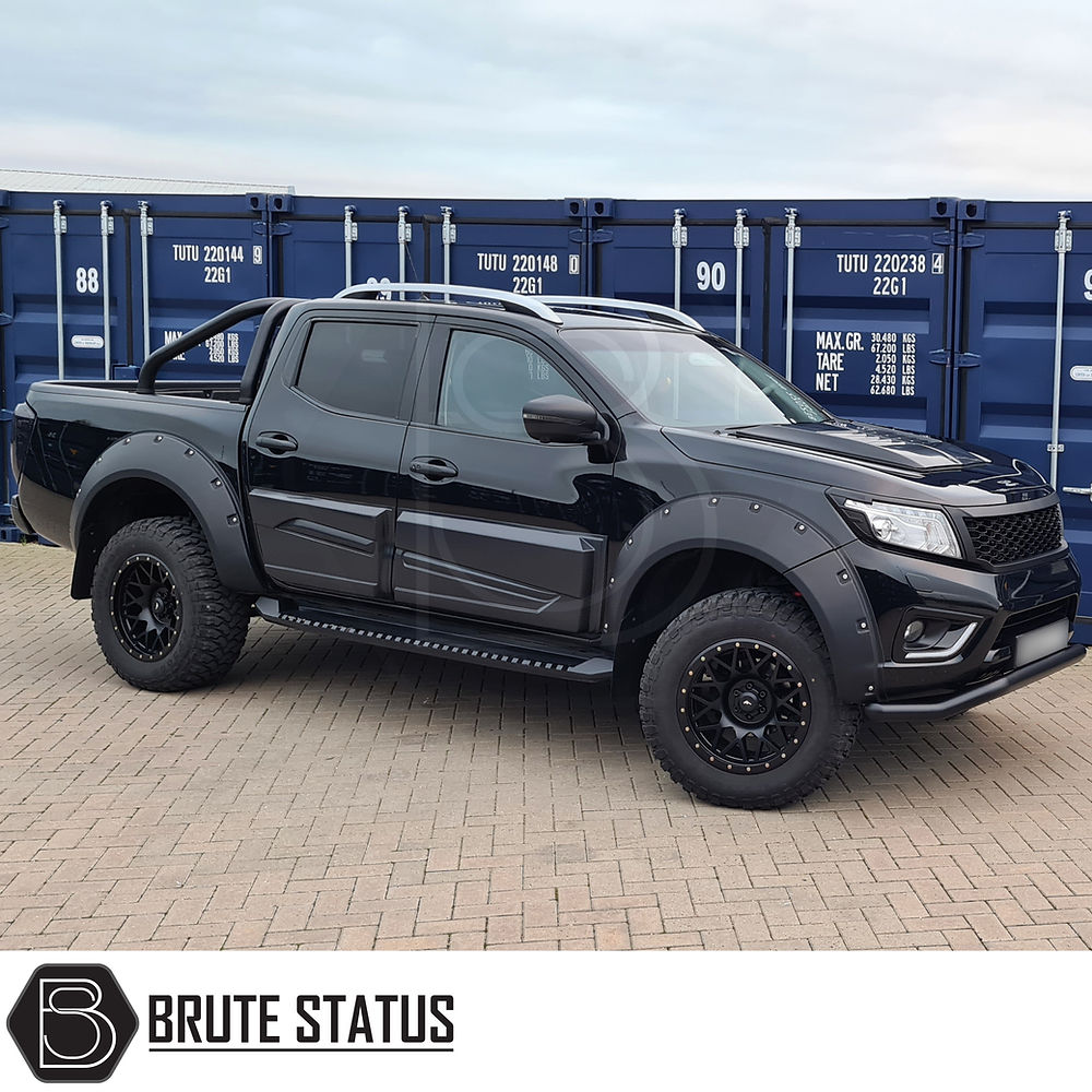 Nissan Navara NP300 2015-2022 Heavy Duty S30 Steel Side Steps in matt black, mounted on a black truck, offering robust protection and style.