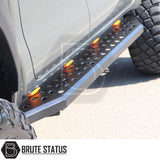 Nissan Navara NP300 2015-2022 Heavy Duty Q30 Steel Side Steps with LEDs, shown close-up, highlighting the robust steel construction and amber LED integration.