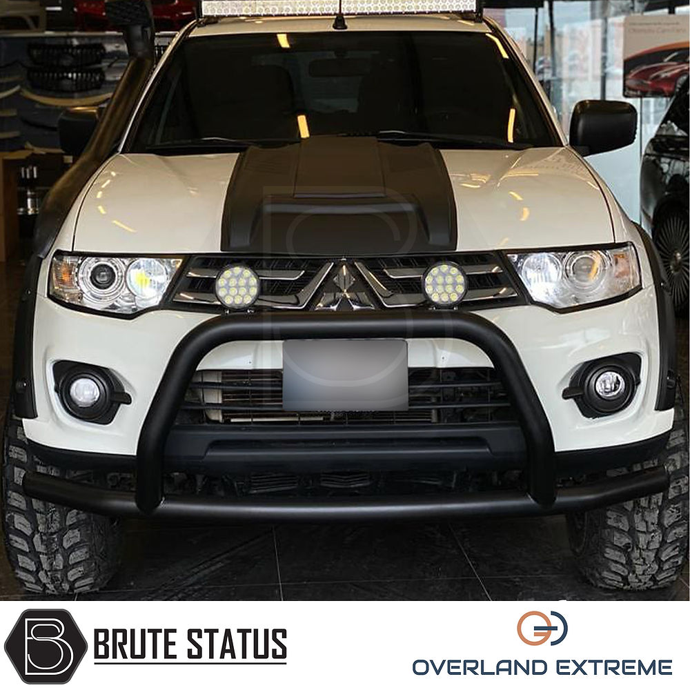 Mitsubishi L200 Series 4 2006-2009 Wide Arch Kit, featuring premium ABS plastic wheel arches with black finish, designed for double cab models.