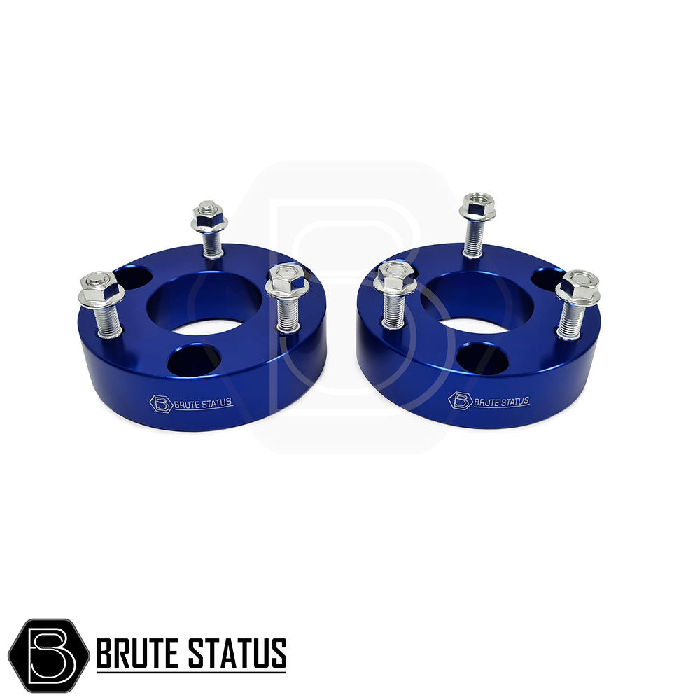 Ford Ranger 2012-2019 2 Inch Lift Kit, featuring blue metal shock spacers with bolts, designed for enhanced vehicle height and durability.