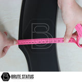 Person measuring with pink tape, highlighting Ford Ranger 2015-2022 T7 T8 Wide Arch Kit's slim, durable design for truck customization from Brute Status.