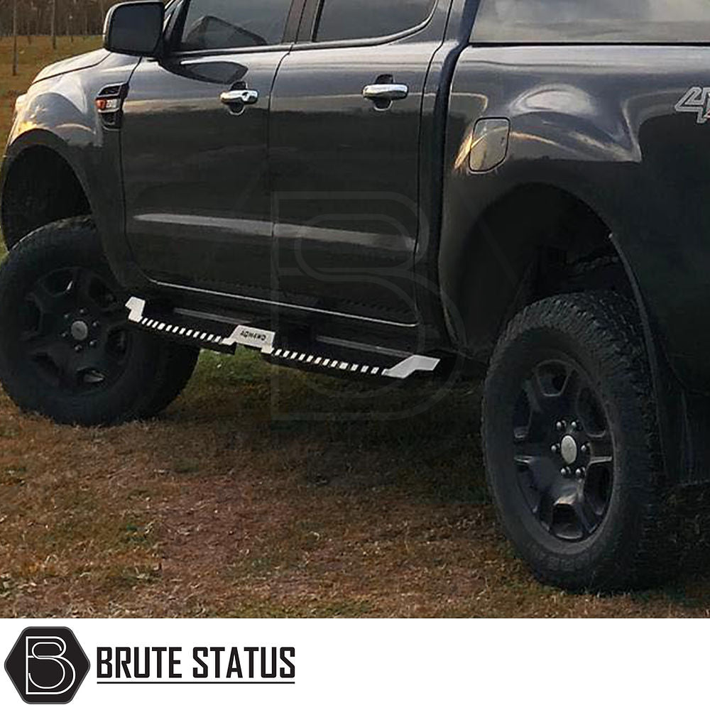 Ford Ranger 2012-2022 Heavy Duty S32 Steel Side Steps, matt black finish, shown on a parked black truck, highlighting robust design and off-road capability.