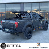 Nissan Navara D40 2005-2010 Overland Extreme Wide Arch Kit on a black truck, showcasing premium wheel arches for enhanced style and durability.