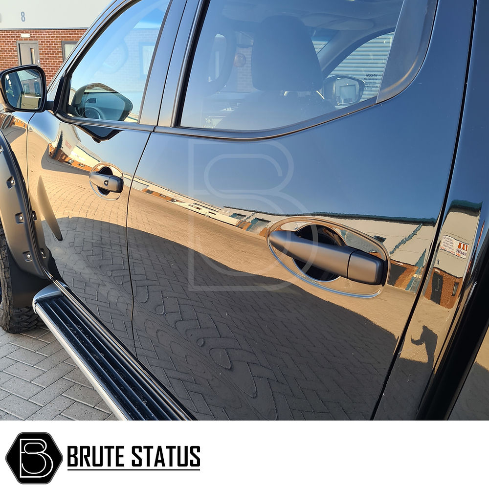 Nissan Navara NP300 2015-2022 Door Handle Covers (Matt Black) shown close-up, emphasizing sleek design and easy installation for a personalized vehicle upgrade.