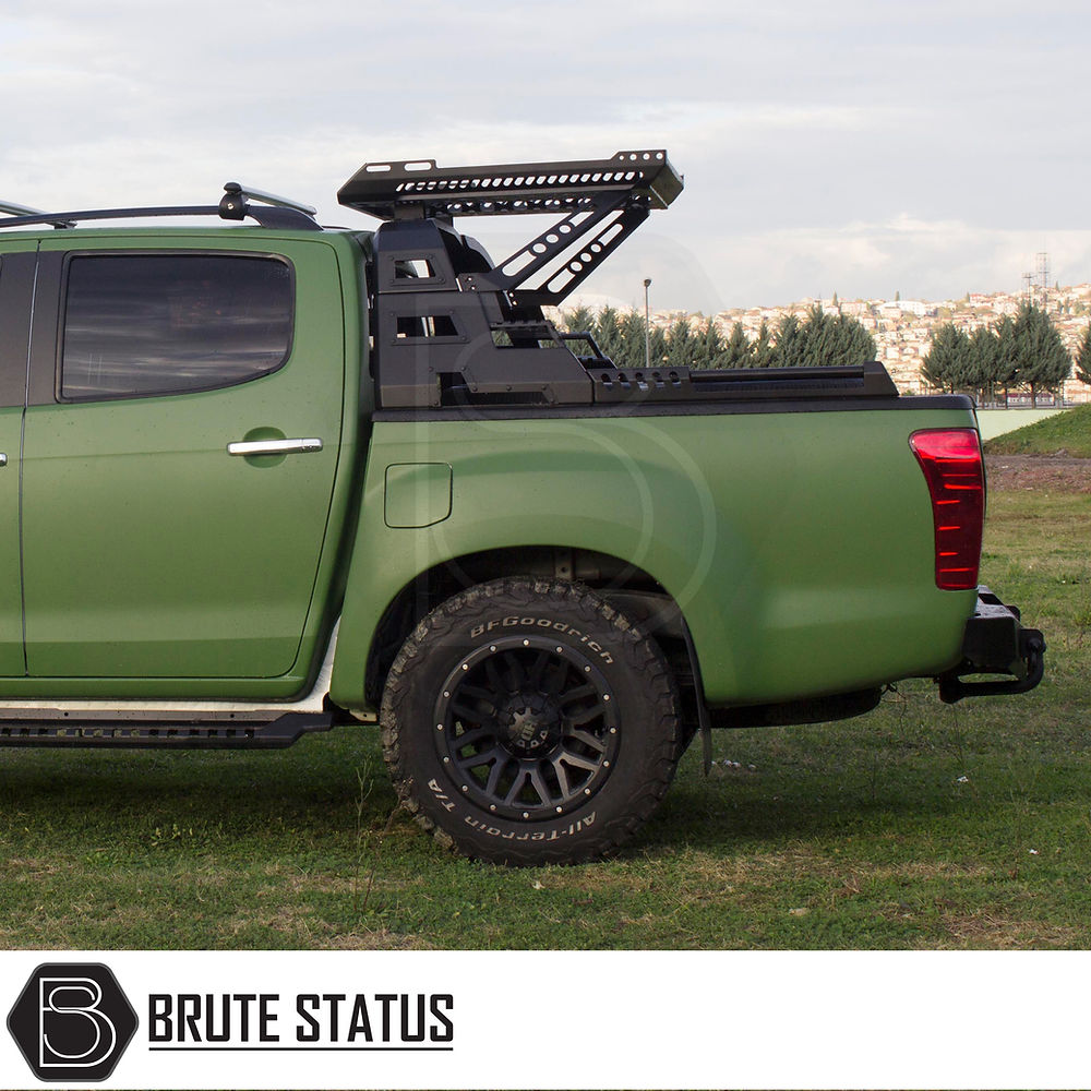 Volkswagen Amarok 2023+ S10 Combat Roll Bar with Storage Basket installed on a parked green truck, showcasing its heavy-duty steel construction and stylish practicality.