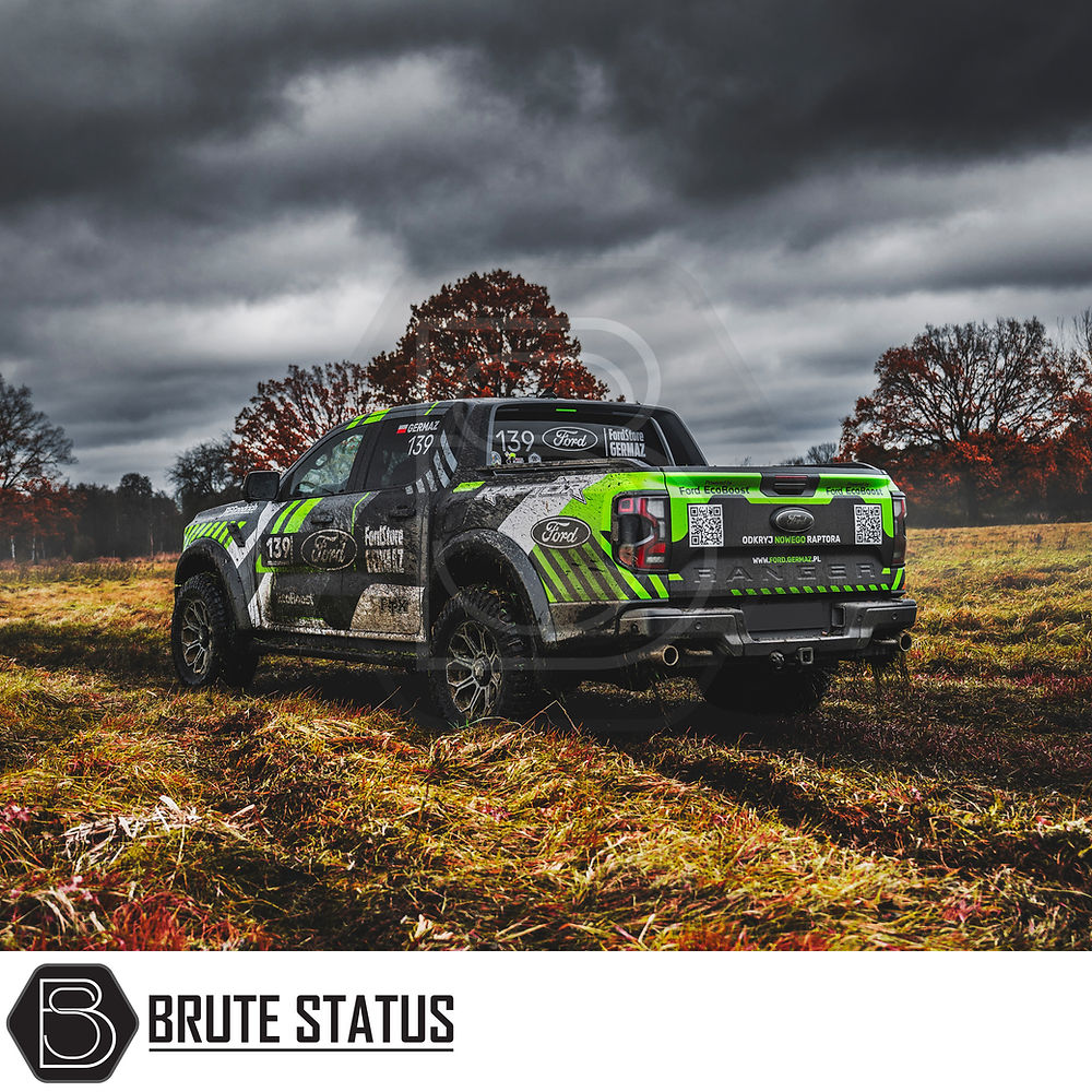 JR Wheels JRX11 in Gloss Black with Machined Face, showcased on a green and black truck parked in a field, highlighting its off-road capability and stylish design.