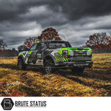 JR Wheels JRX11 in Gloss Black with Machined Face, showcased on a green and black truck parked in a field, highlighting its off-road capability and stylish design.