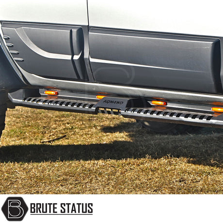 Isuzu D-Max 2004-2011 Heavy Duty S32 Steel Side Steps with LEDs, shown on a vehicle, featuring a durable matte black finish for enhanced protection.