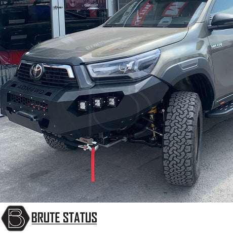 Toyota Hilux 2015-2020 heavy duty winch front bumper with matte black finish, LED lights, and space for winch, enhancing functionality and style.