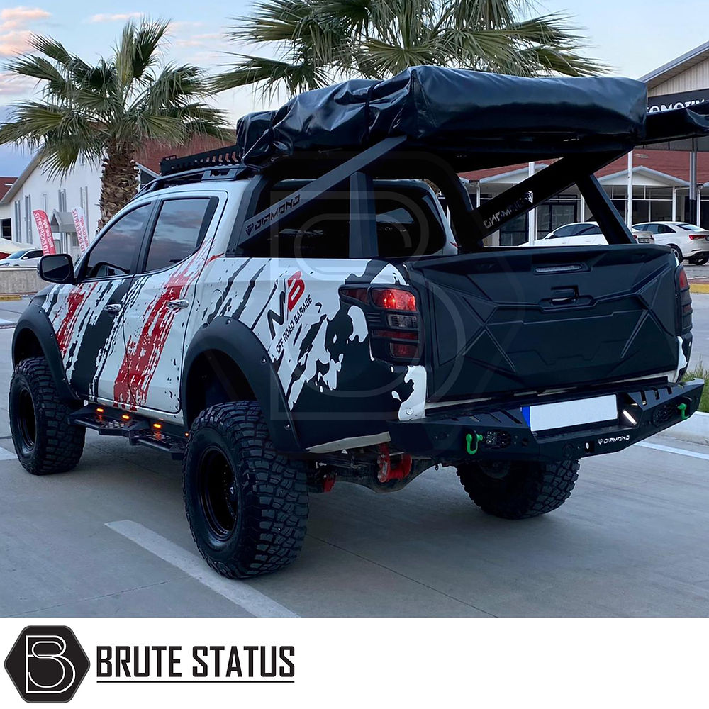 Mitsubishi L200 2019-2021 tailgate cladding cover, matte black, shown on truck for durability and protection. Ideal aftermarket accessory for customization.