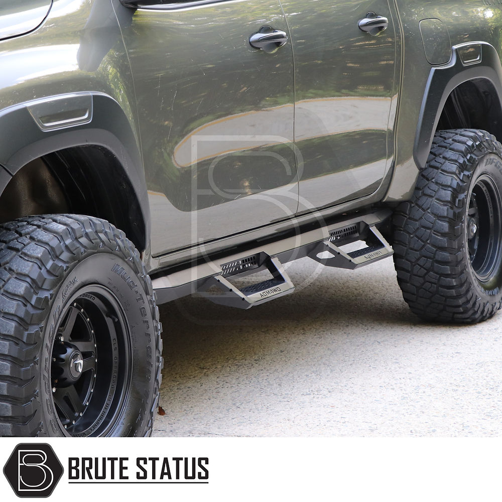 Close-up of Toyota Hilux 2015+ Heavy Duty T32 Steel Side Steps, showcasing robust matt black finish and sturdy construction for enhanced vehicle protection.