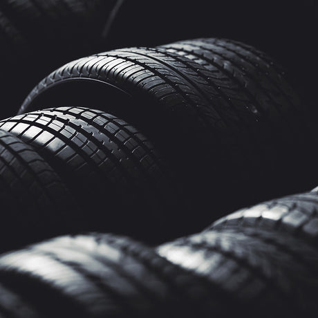 Stack of Wolfrace Amazon 20 Alloy Wheels, Gloss Black with Polished Face, showcasing the intricate wheel design and detailing.