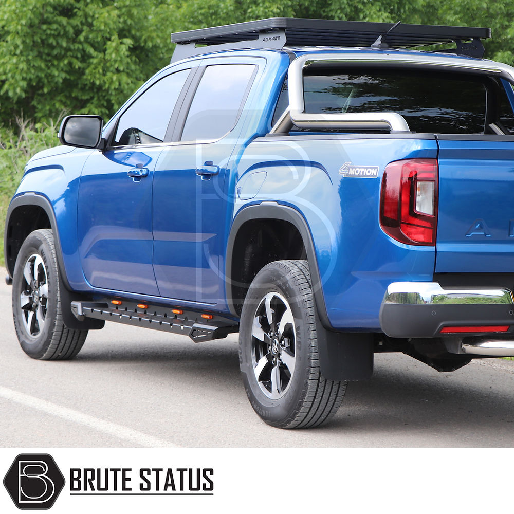 Toyota Hilux 2015+ Heavy Duty M30 Steel Side Steps with LEDs, shown installed on a blue truck, featuring a robust matt black finish for enhanced protection.