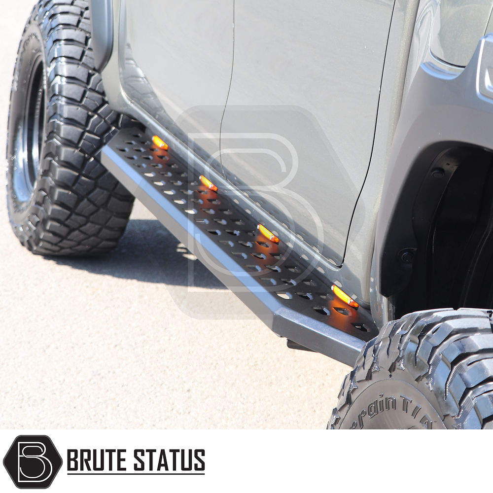 Nissan Navara NP300 2015-2022 Heavy Duty Q30 Steel Side Steps with LEDs, shown close-up, emphasizing the robust metal step design and tread pattern.