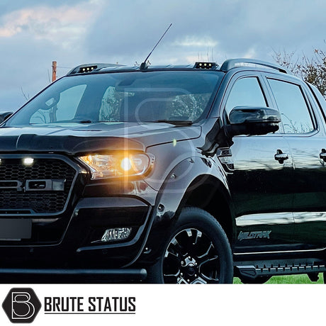 Ford Ranger Black Roof Rail Kit 2012-2022 on a black truck, highlighting high-quality aftermarket design for de-chroming and enhancing pickup individuality.