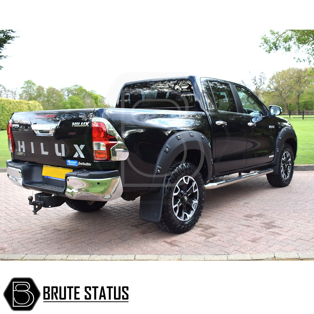 Toyota Hilux 2018-2020 Wheel Arch Kit (Riveted Style) on a black truck, featuring durable, textured black finish with fitting kit for easy installation.